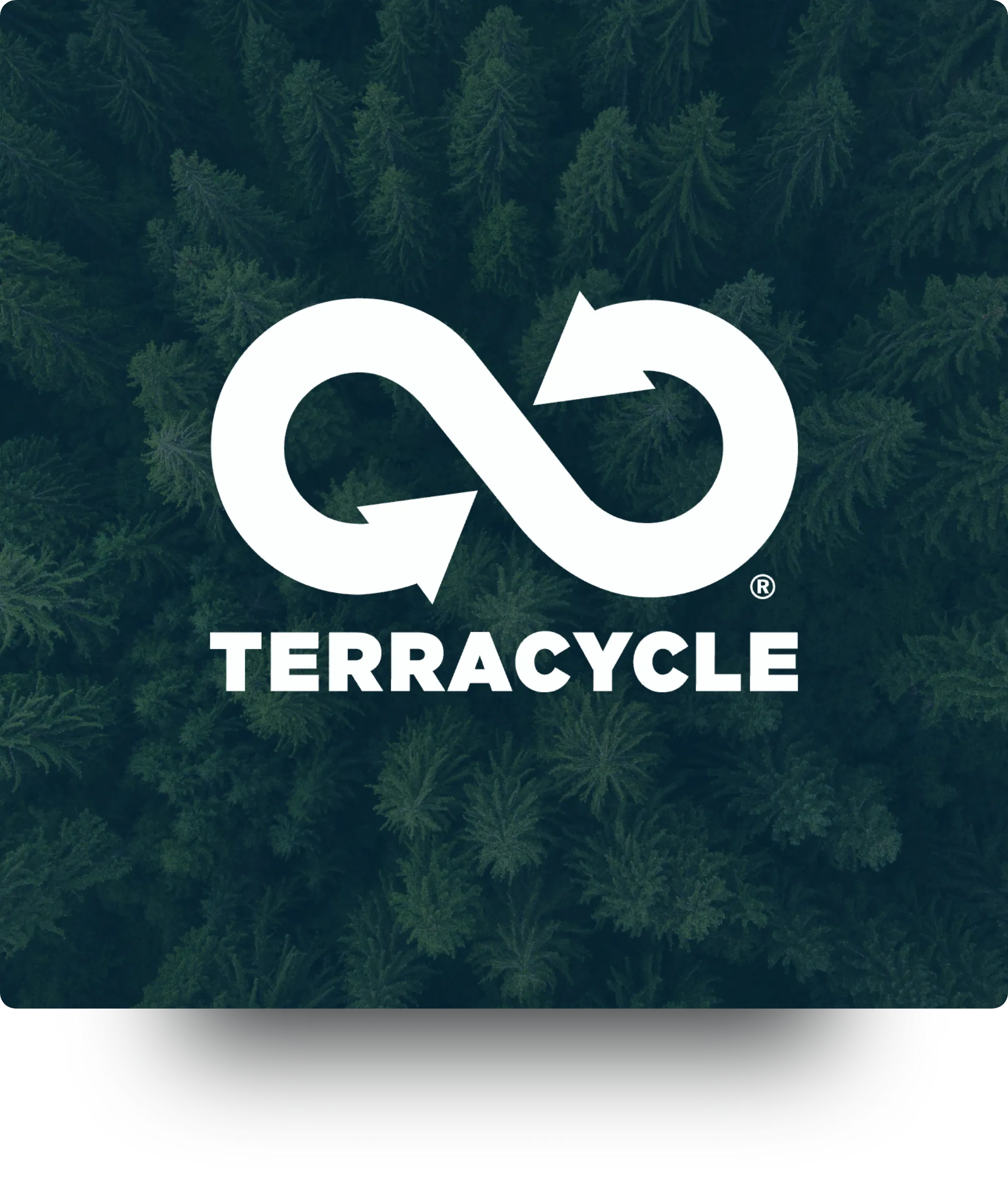 A man in bed, looks at his illuminated phone.